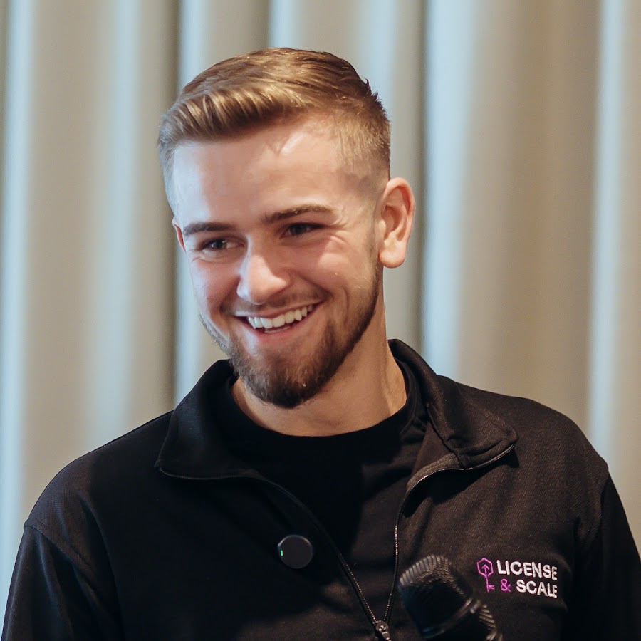 Cameron England, founder of License & Scale, speaking at a mastermind event